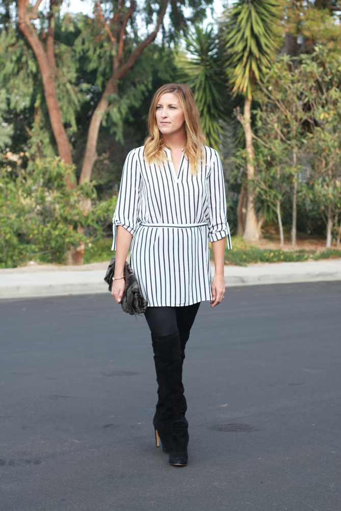 A black and white striped tunic with thigh high boots and leather leggings featured by popular Los Angeles fashion blogger, The Fashionista Momma