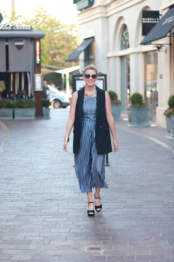 The Fashionista Momma shares a striped jumpsuit and a vest. - The Fashionista Momma