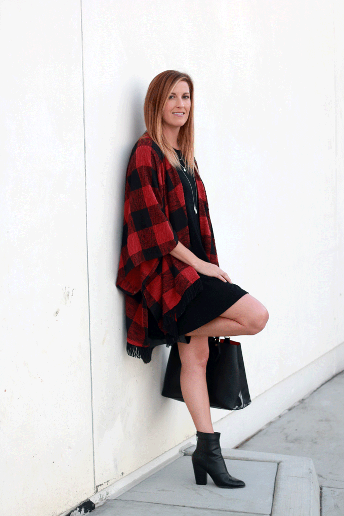 The perfect plaid coverup over a black dress with ankle boots.