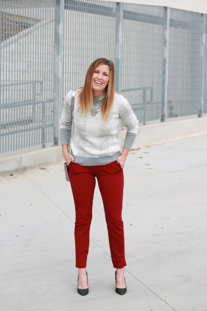 Red ankle skinny pants and buffalo plaid top with a statement necklace.