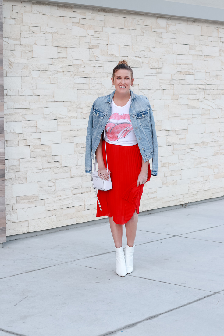 The Fashionista Momma styles a red skirt, graphic tee and denim jacket.