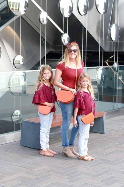 Mommy And Me Purses by Popular US fashion blogger, The Fashionista Momma : image of mom and girls in matching outfits