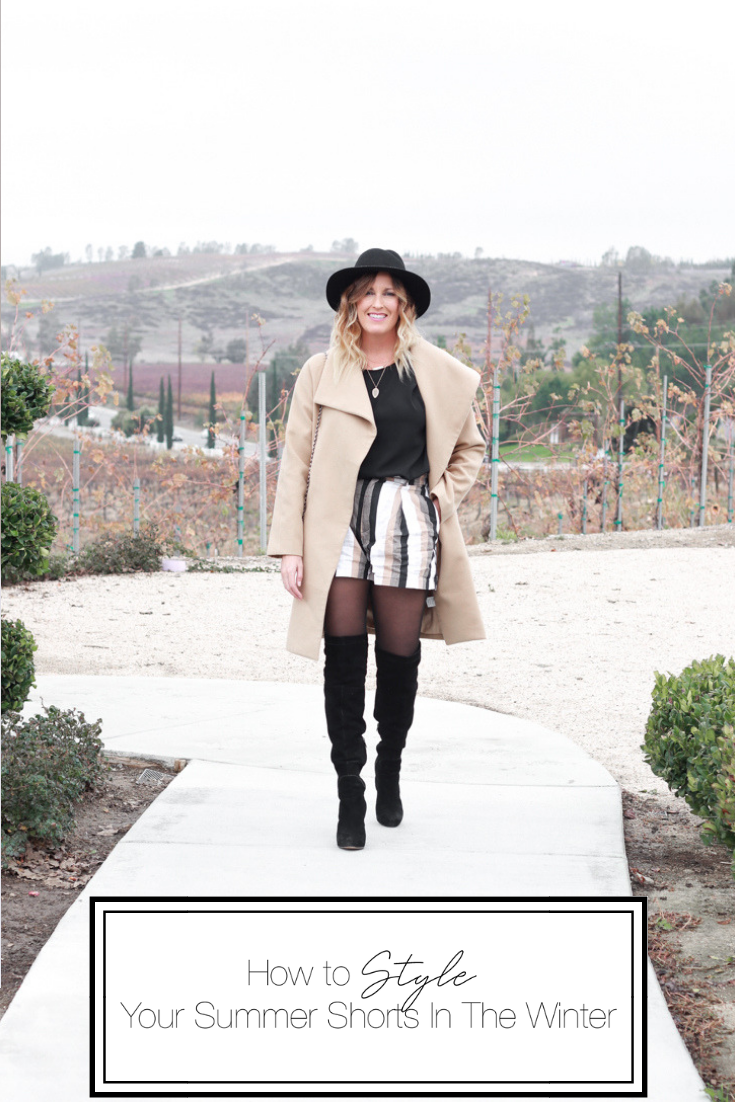 How to Style Your Summer Shorts In The Winter featured by Top US Style Blog, The Fashionista Momma; blonde woman wearing striped shorts, OTK Boots and a camel wool coat.
