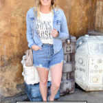 Must Have Graphic Tees featured by popular US Style Blogger The Fashionista Momma; woman wearing graphic tee and cutoff shorts