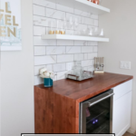 Popular US Style Blogger, The Fashionista Momma, shares the perfect DIY Custom Bar Area with a waterfall edge butcher block countertop; DIY Bar Area with butcher block counter