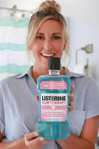 How I Beat Gum Disease featured by US Top Lifestyle Blogger, The Fashionista Momma; woman with LISTERINE® Gum Therapy antiseptic mouthwash