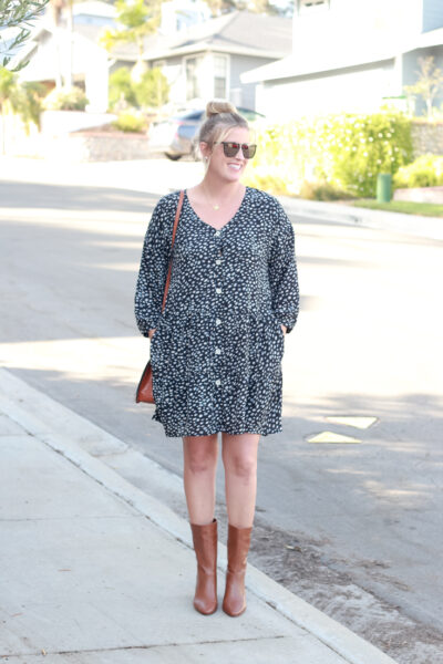The perfect dark print dress for fall with ONecklace featured by popular US Style Blogger, The Fashionista Momma. woman wearing a dress and boots.